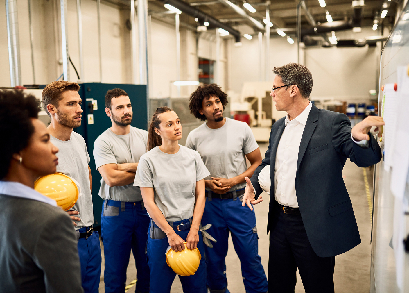 Business delegates on a guided manufacturing facility tour