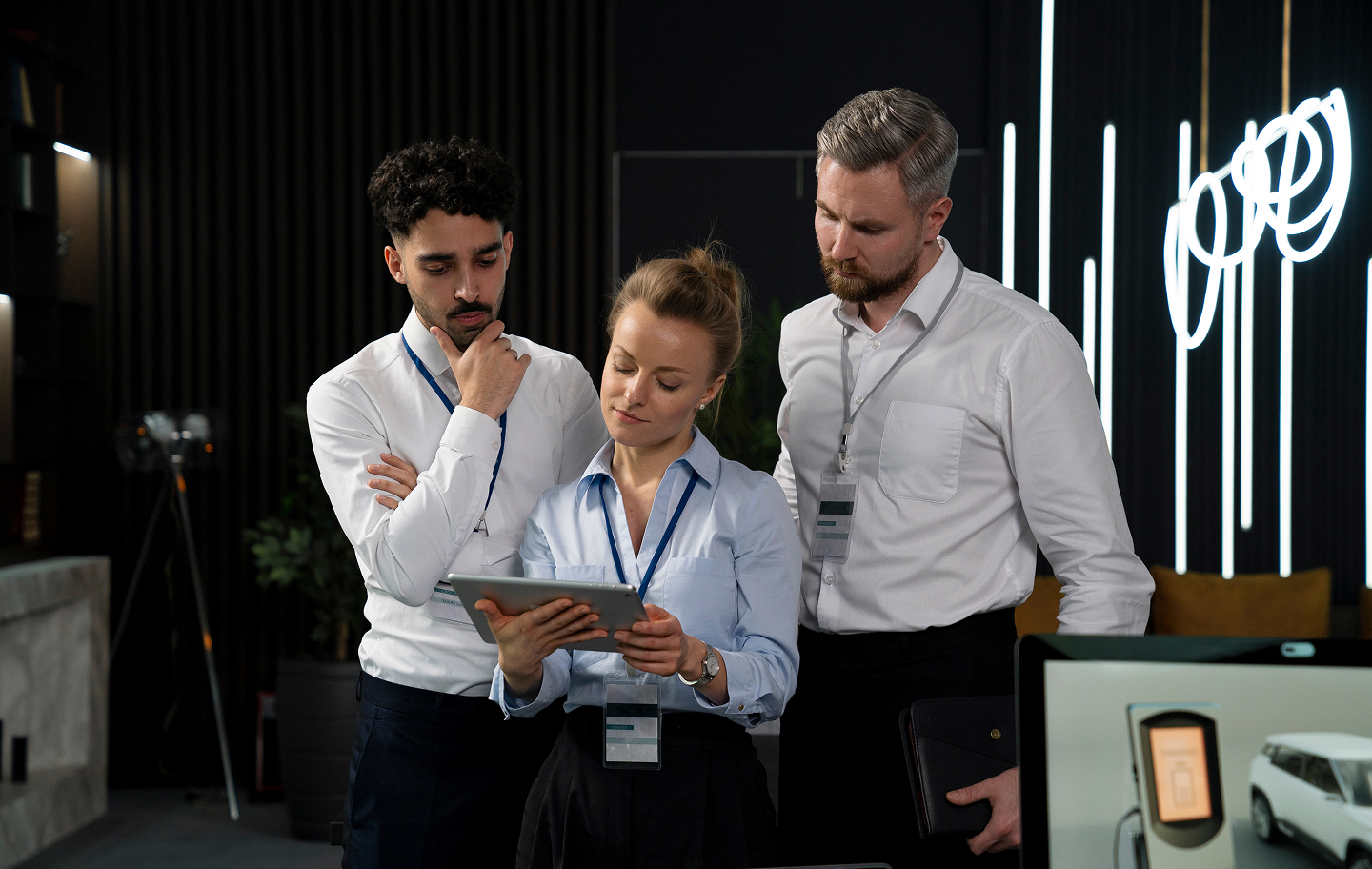 Colleagues reviewing information on a tablet