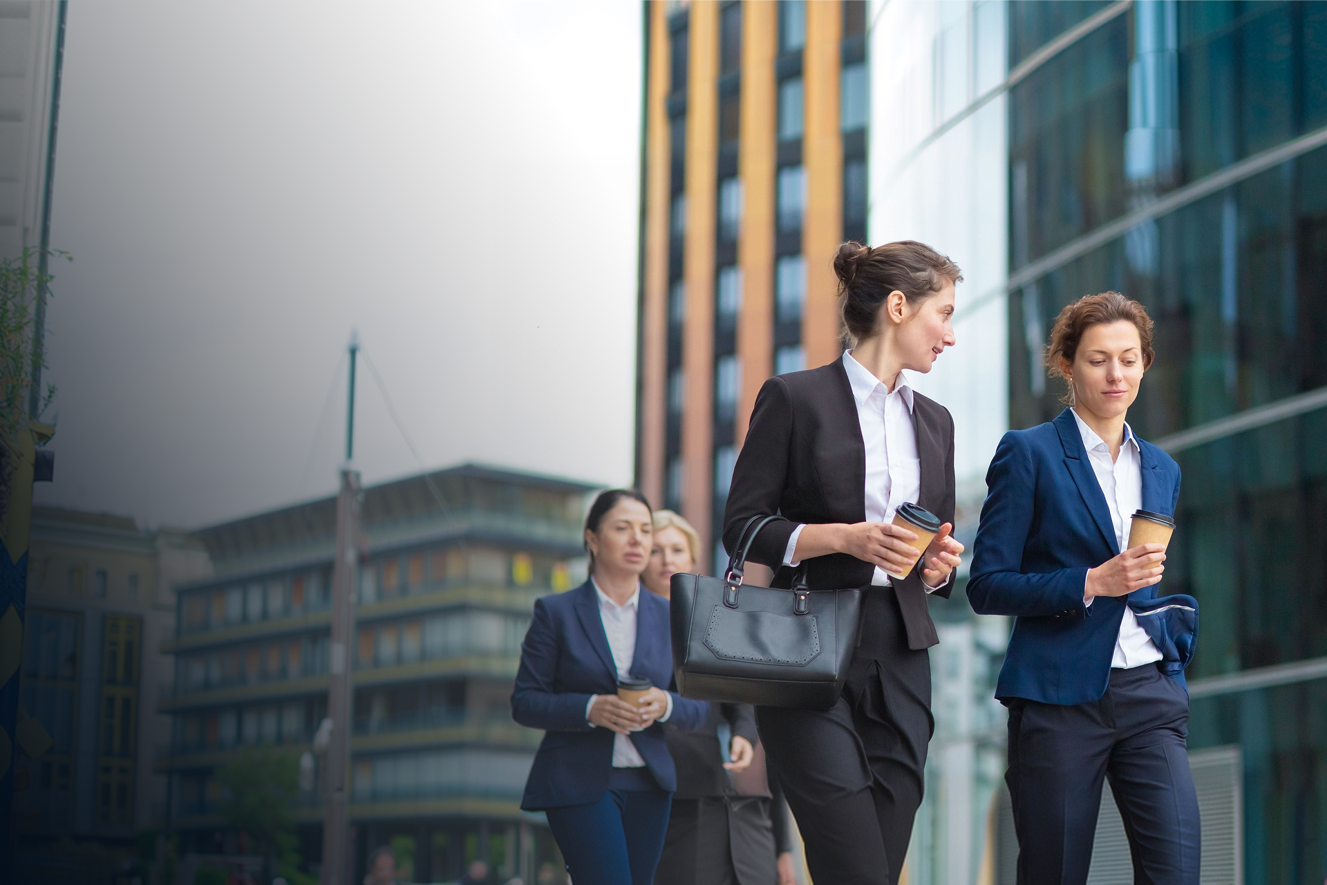 Corporate delegates walking together outside a business venue